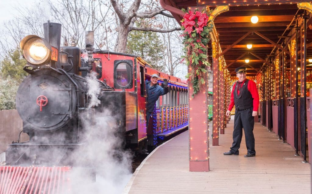 A holiday steam engine gears up for a seasonal route near Silver Dollar City.