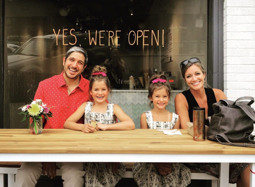 A family enjoys ice cream at Sweet Action Ice Cream.