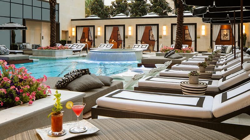 The outdoor pool and pool deck loungers at The Post Oak Hotel at Uptown Houston.