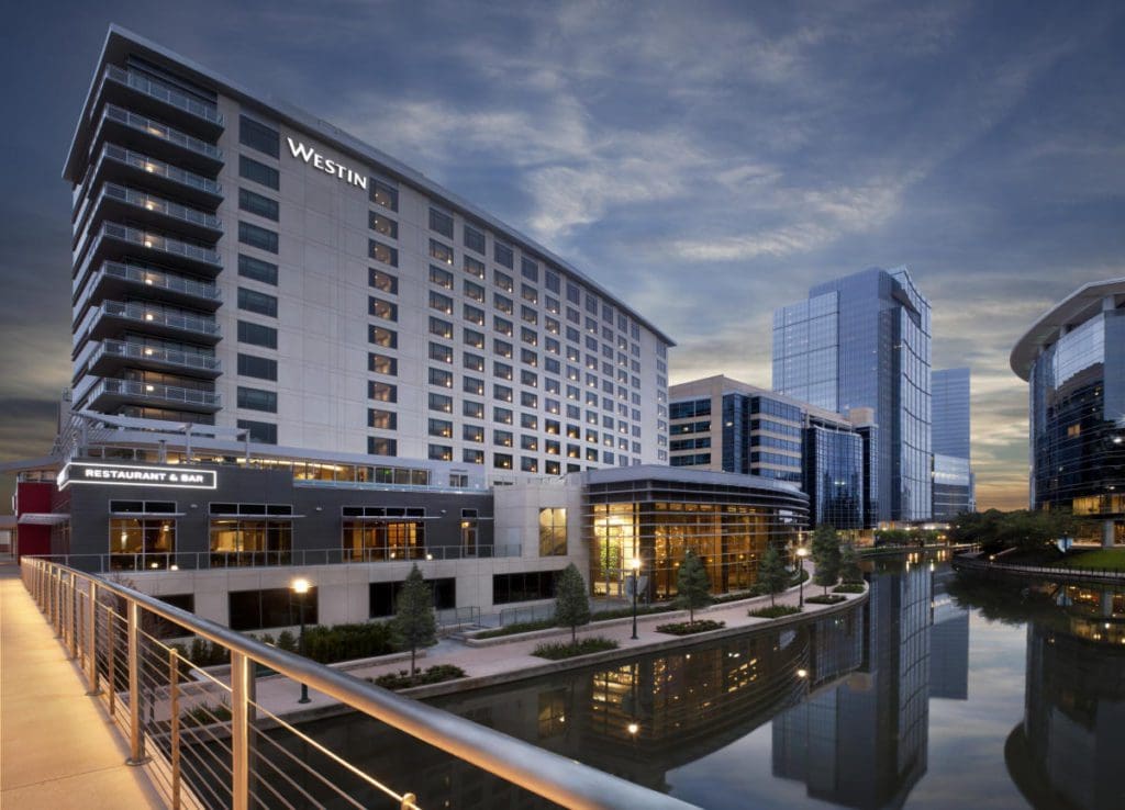 The exterior to The Westin at The Woodlands, along the city skyline.