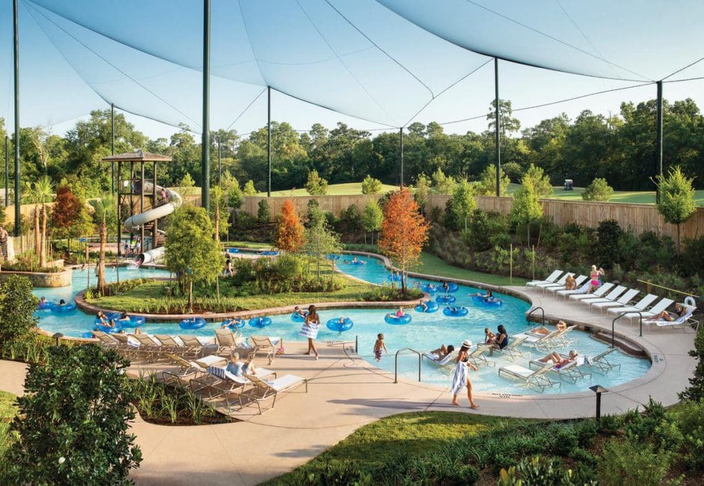 People enjoy the outdoor pool at The Woodlands Resort, Curio Collection by Hilton.