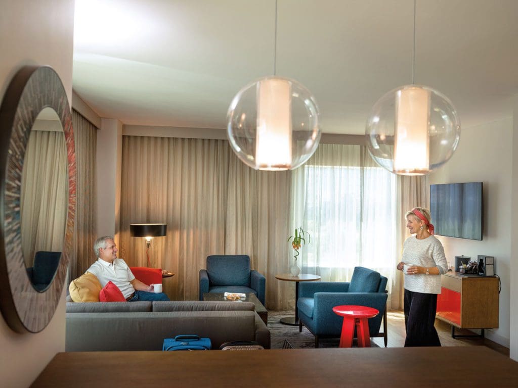 An older couple enjoys a cozy afternoon, while staying at the Hyatt Regency Bloomington-Minneapolis.