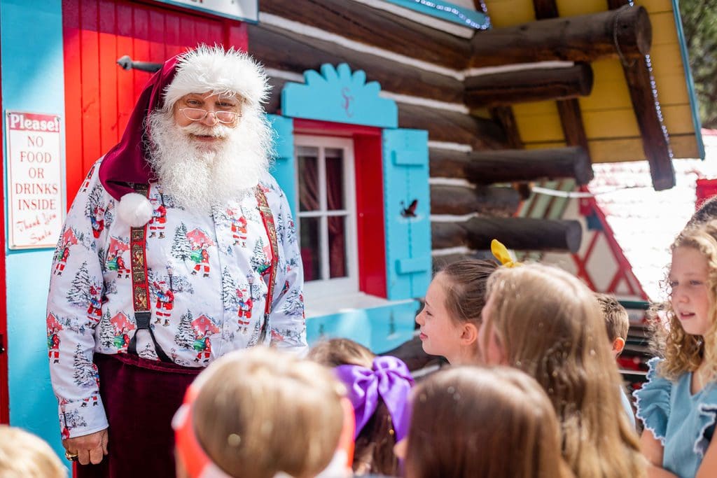Santa greets several children at a Christmas event in Colorado Springs.