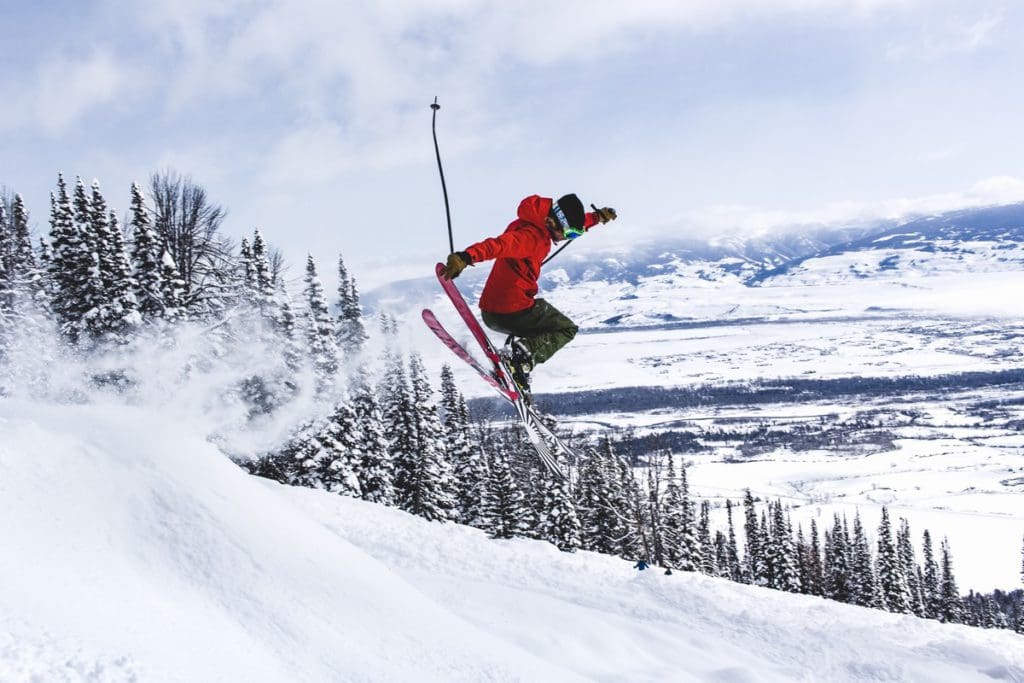 A teen skis along a downhill slope near Jackson Hole.