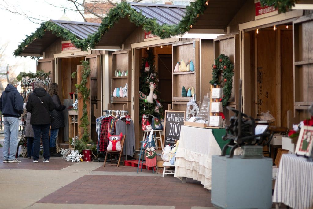 Lovely, European-style vendor huts at the Kerstmarkt Christmas Market, one of the best Christmas Markets in the United States for families.