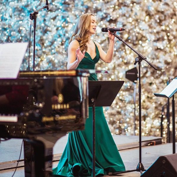 A woman sings Christmas songs at a holiday concert at the Mall of America.