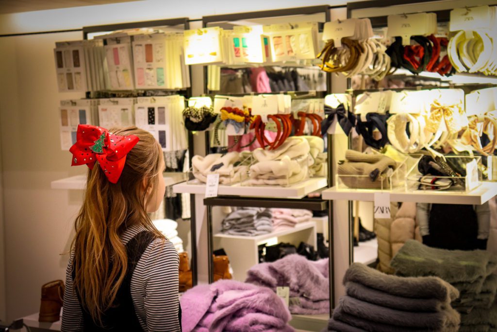 A young girl looks at bows, while shopping at Zara in the Mall of America.