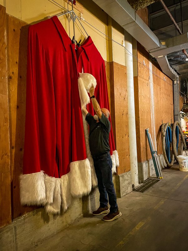 A tour guide shows off the behind-the-scenes storage area of Paul Bunyan's Christmas cloak at the Mall of America.