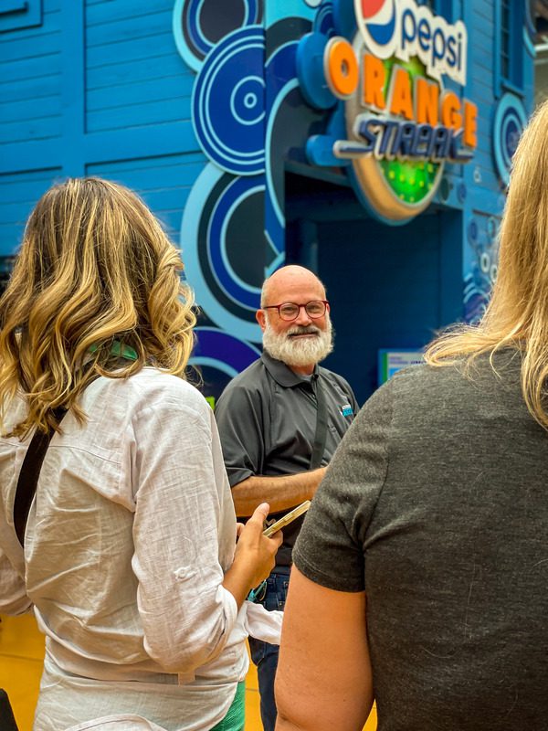 A tour guide leads a discussion about the history of the Mall of America.