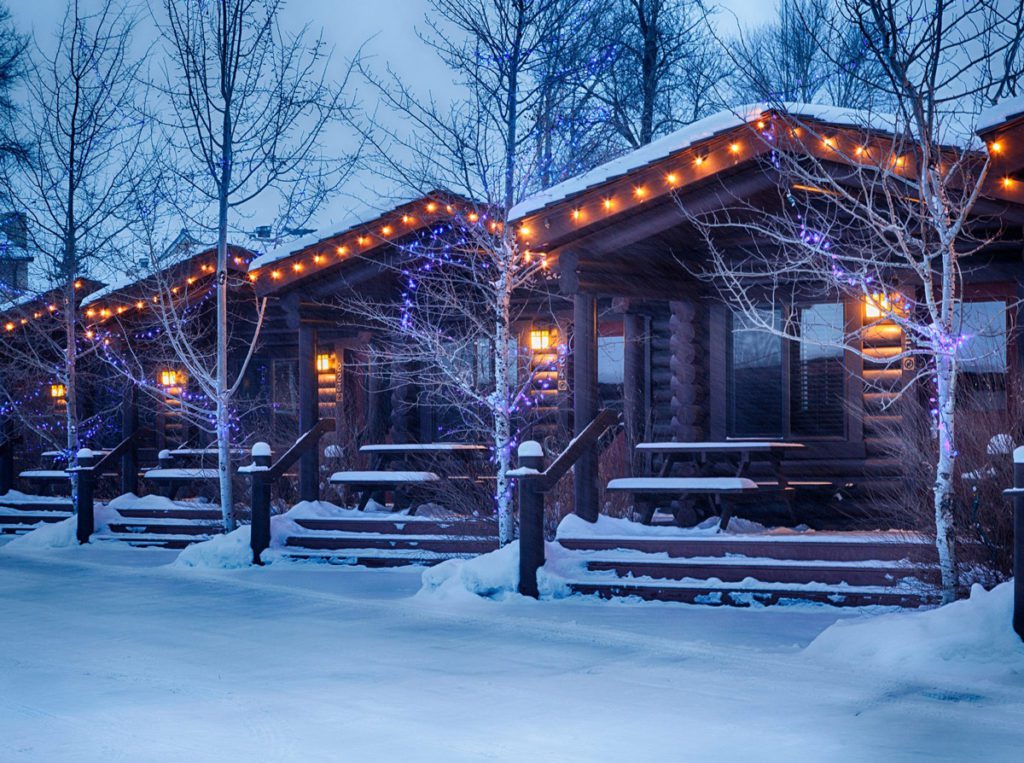 Winter cabins at the Elk Country Inn surrounded by snow