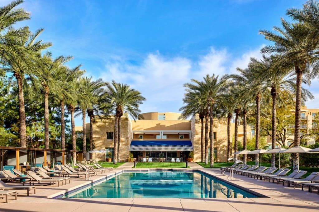 The pool surrounded by Palm Trees at the JW Marriott Desert Ridge Resort and Spa, one of the best hotels in Phoenix for families