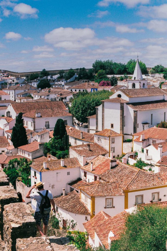 An aerial view of the orange rooftops in Obidos, one of the best places to visit in Portugal with kids. 