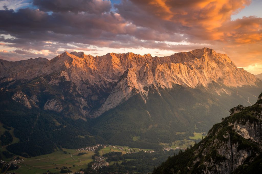 A sweeping mountain view with a cozy city below in Garmisch-Partenkirchen.