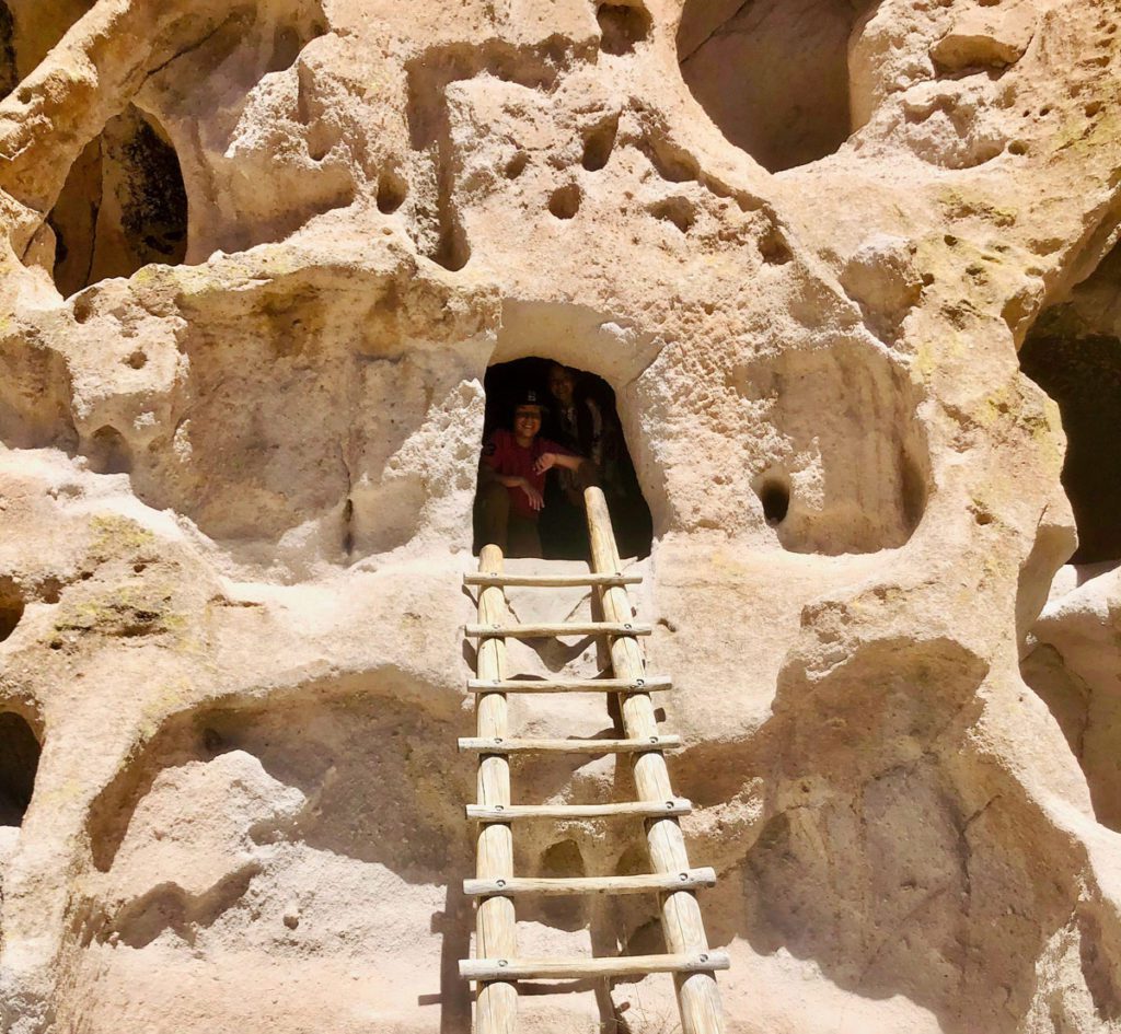 A family posing at Bandelier National Monument in New Mexico