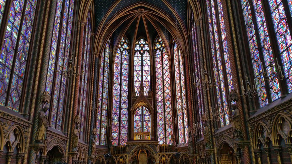 A stained-glass window in Sainte-Chapelle in Paris, one of the best places to visit on a Paris itinerary with tweens or teens. 