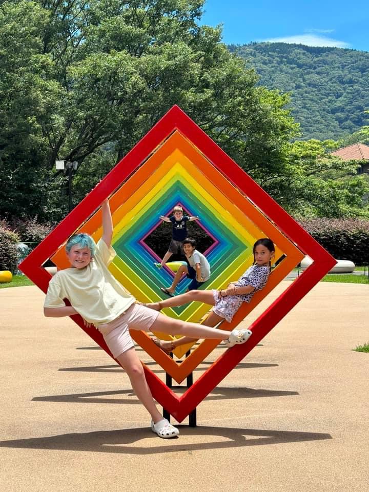 Kids playing with the sculptures at the Hakone Open-Air Museum.