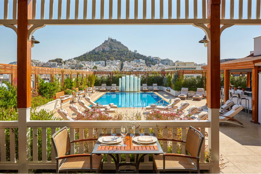 A view of the outdoor pool at the Hotel Grand Bretagne, one of the best hotels in Athens for families. 