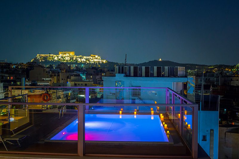 A nighttime view of the outdoor pool at the Novus City Hotel in Athens. 