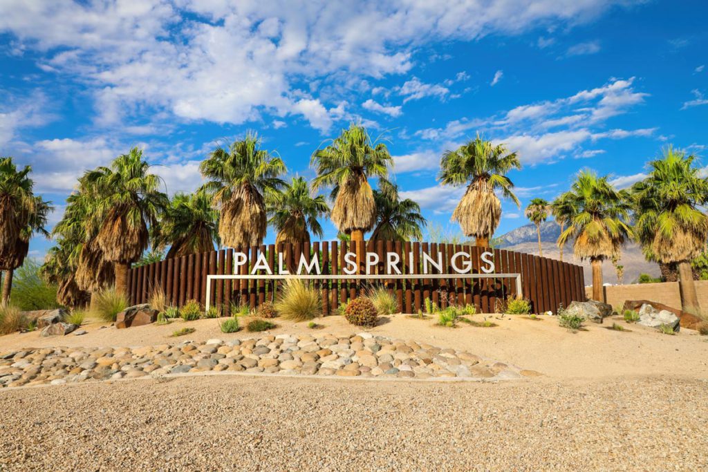 A sign that says Palm Springs located in Palm Springs, California.