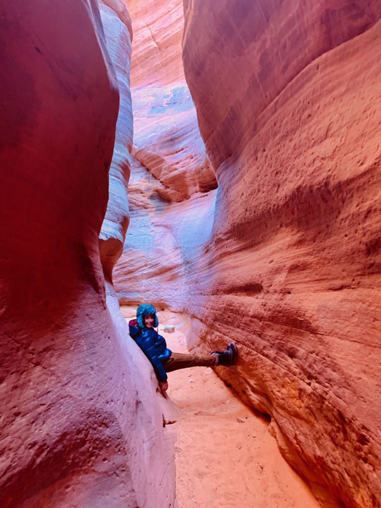 A young boy in Peekaboo Slot Canyon, Kanab. It's one of the best bucket list experiences in the United States for your family.