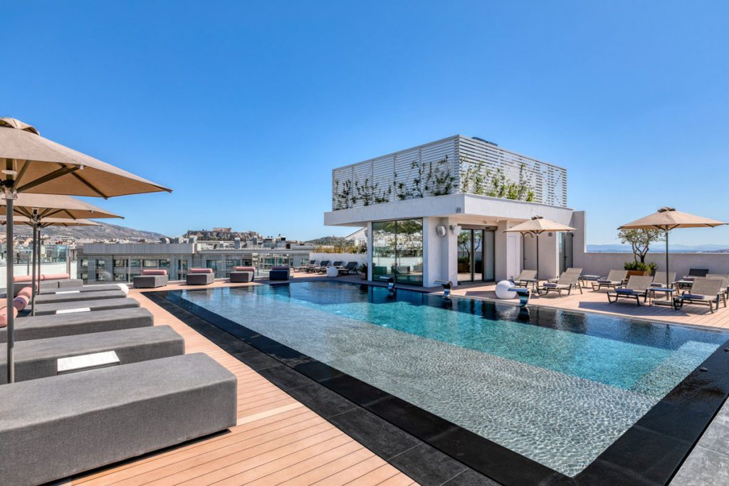 A view of the outdoor rooftop pool at The Stanley Hotel, one of the best hotels in Athens for families. 