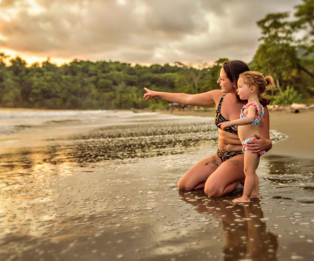 A mother and a child on the beach in Costa Rica.