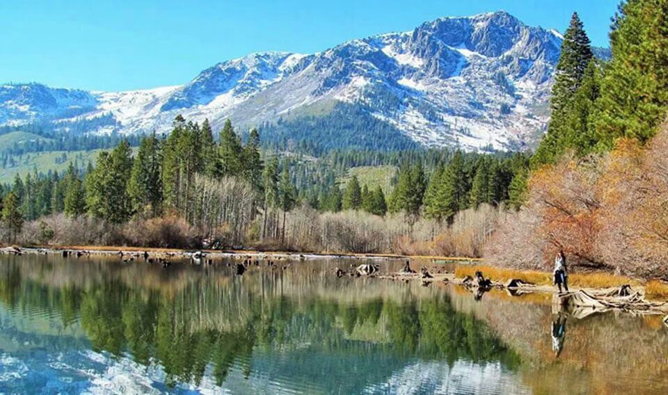 A view of someone standing on the shores of Fallen Leaf Lake in South Lake Tahoe. 