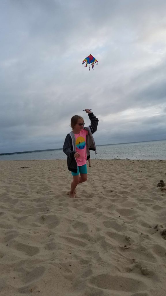 A child playing in the sand in Eastham, Cape Cod.