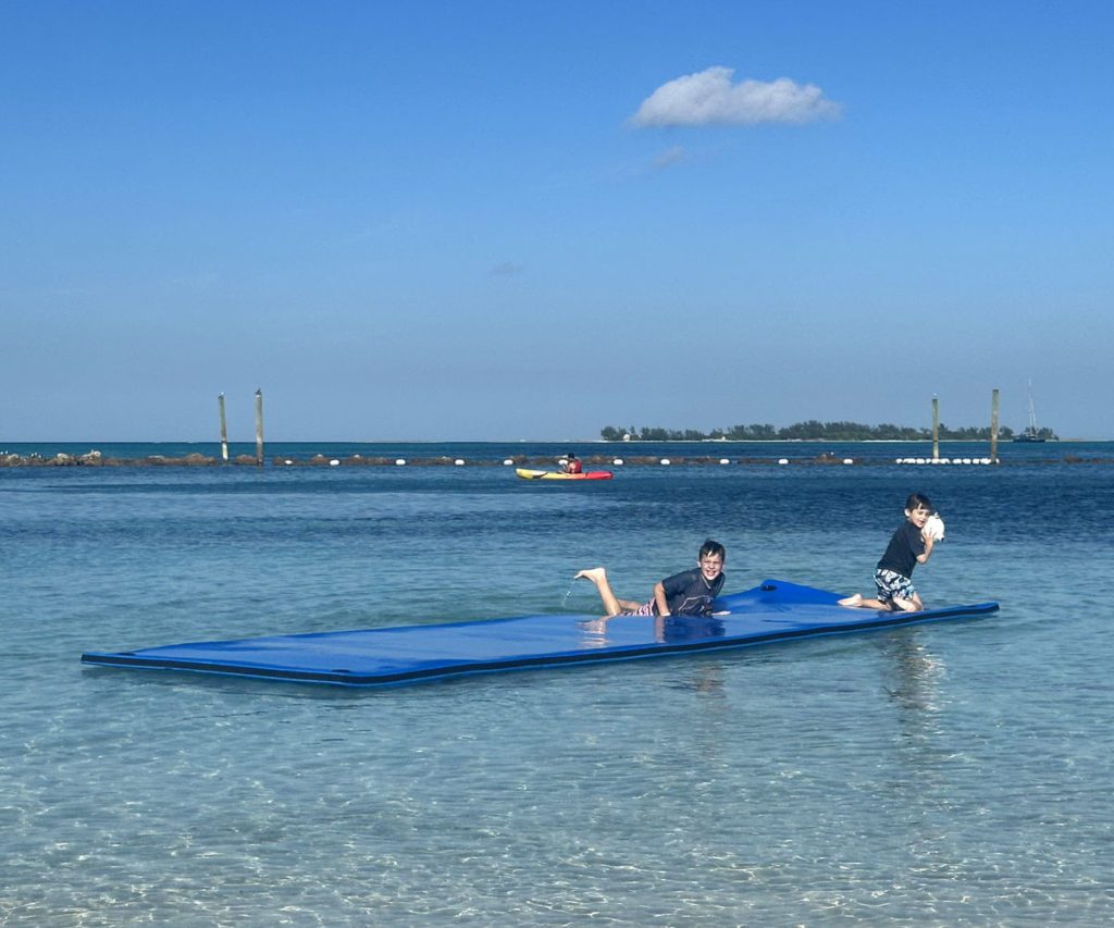 Two young boys playing in the water at Baha Mar Resort in the Bahamas.