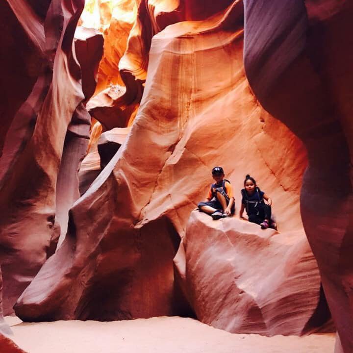 Two kids posing in Antelope Canyon in Page, Arizona.