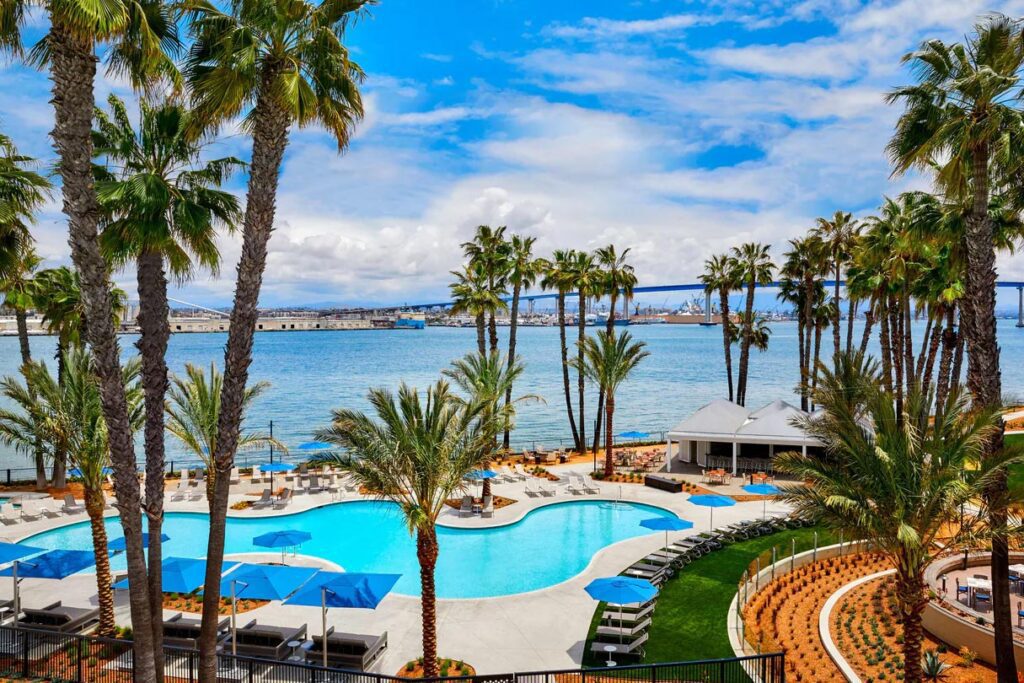 A view of the pool surrounded by palm trees at the Coronado Island Marriott Resort & Spa