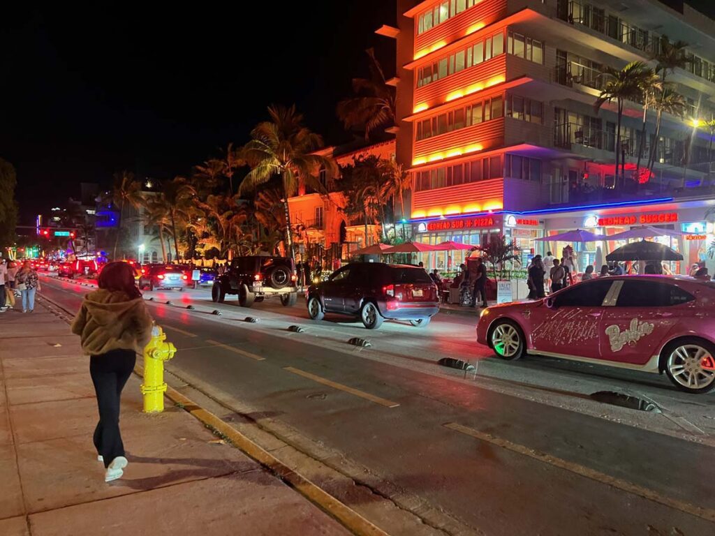 Nightlife scene on Ocean Drive in Miami Beach, with vibrant lights and busy streets.