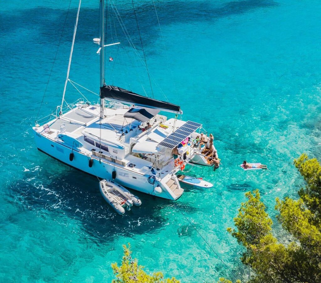 Family enjoying a skippered catamaran charter in the Mediterranean