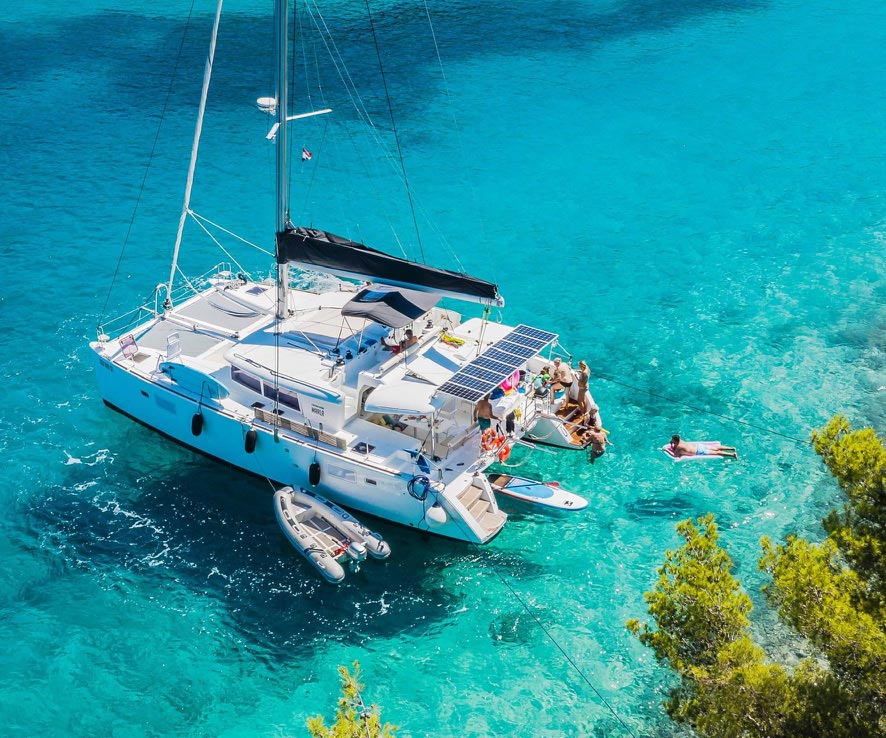 Family enjoying a skippered catamaran charter in the Mediterranean